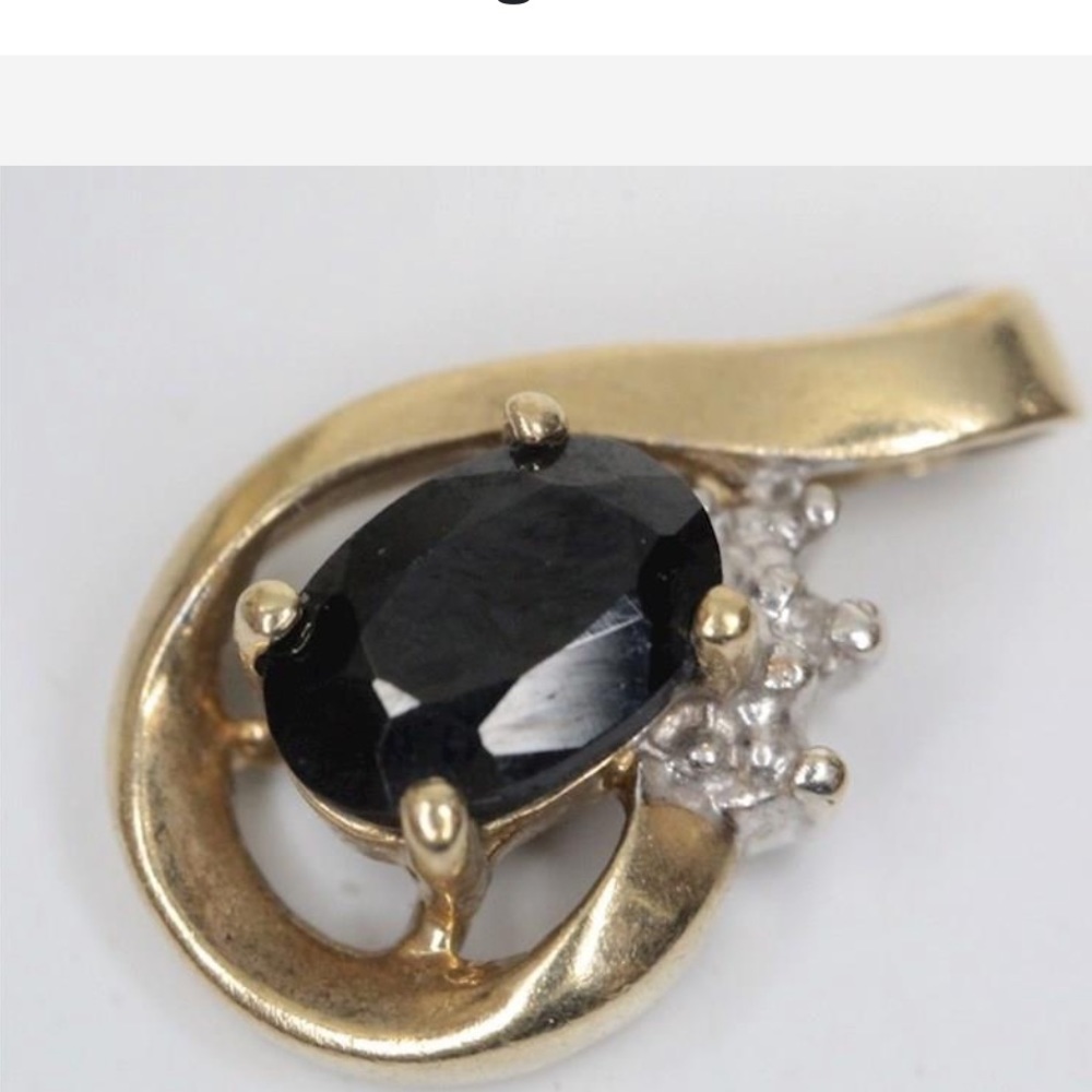 10 K yellow gold Spinel ( dark blue/black) with diamond pendant